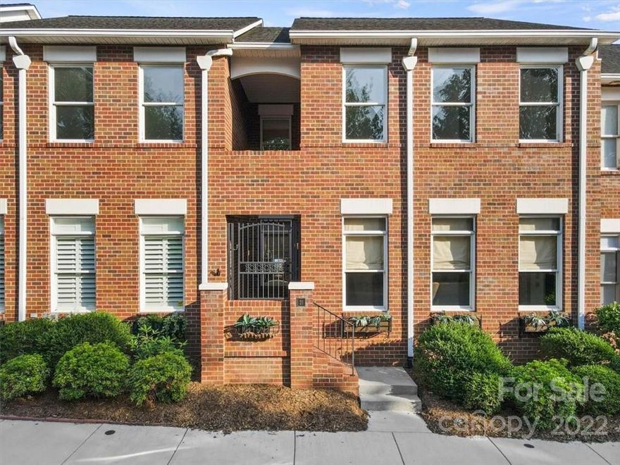 Stunning remodel on this three bedroom townhouse in Viewmont, now offering a Southwestern-inspired interior with rustic elegance around every corner! The gated front entrance leads into a covered vestibule with double doors to the two-story great room offering a custom iron and antler chandelier, gas fireplace with stone surround flanked with built-in shelving, and an adjoining dining area with leather-upholstered wall with nail head trim. The updated kitchen has custom cabinetry, granite countertops, stone backsplash, pantry, and stainless appliances. A small hallway leads to the half bath with laundry closet, door to the rear terrace, and the primary suite with huge walk-in closet and remodeled bath with tiled double shower, custom vanity, and free-standing tub. The stairs to the upper level have a custom iron railing with tiled stair risers, leading up to two spacious bedrooms with a shared bath. A private rear terrace exits to the single garage. HOA Dues: $377.50/Quarter.