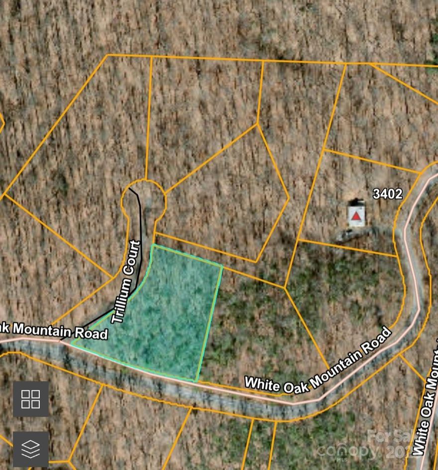 Privately located on the backside of White Oak Mountain - this large 1+ acre lot sits on the corner of White Oak Mountain Rd. and Trilium Ct.  Lot is the middle one lot out of 5 for sale in a row along White Oak Mountain Rd. - this is a good opportunity to buy a couple lots to insure extra privacy!  White Oak Mountain is located in Columbus, NC and offers a peaceful & quiet location to live, abounding with wildlife, scenic ponds, trails, and more.  White Oak is where Blue Ridge got their beginning back in the 80's, developing log cabins on the mountain. While the Mountain attracts many full time residents, it is still a very popular getaway location today... for 2nd homes & retirees!  The Association offers fishing ponds, picnic areas, a pavilion for residents to use, and walking trails. The association has a very informative website. Restrictions apply - no manufactured homes, HOA Dues, etc.