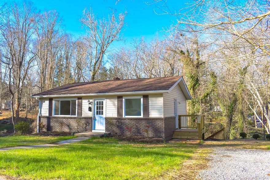 Turn key in the heart of West Asheville with tons of storage!  This full renovation features 4/2 open plan, new kitchen w/ granite & stainless appliances, 2 upfit baths, split floor plan w/master on main, & 3 bright bedrooms plus bath on lower level.  Dry basement has laundry and plenty of additional space for storage or workshop.  Lot has level front yard, w/ front & side entrance, plus rear entrance to basement. Property extends well off back of house so privacy won't change.  Must See!