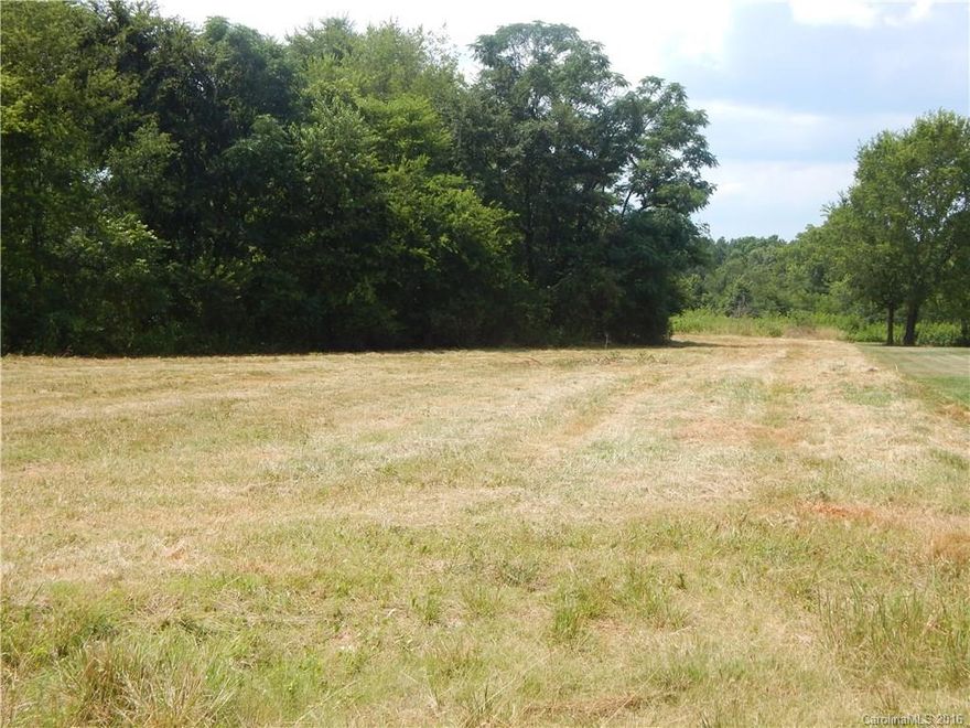 Large, partially cleared lot flat lot in popular Herndon Heritage subdivision.