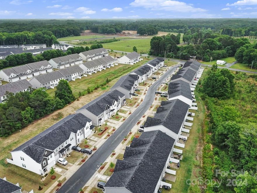 Welcome to Poplin Glen of Indian Trail! Beautiful, two-story townhomes with garages and private patios. Great chance for homeownership in a booming Union County suburb! Open concept layout with fridge, blinds, and washer/dryer included. Vinyl plank floors on main level and carpet upstairs. Spacious kitchens with granite counters and stainless appliances. Ample storage and upgraded features. Conveniently close to 74 bypass, easy access to Uptown Charlotte and nearby amenities. Amazing seller contributions up to 6% toward closing costs or rate buydown to make owning these units a reality!