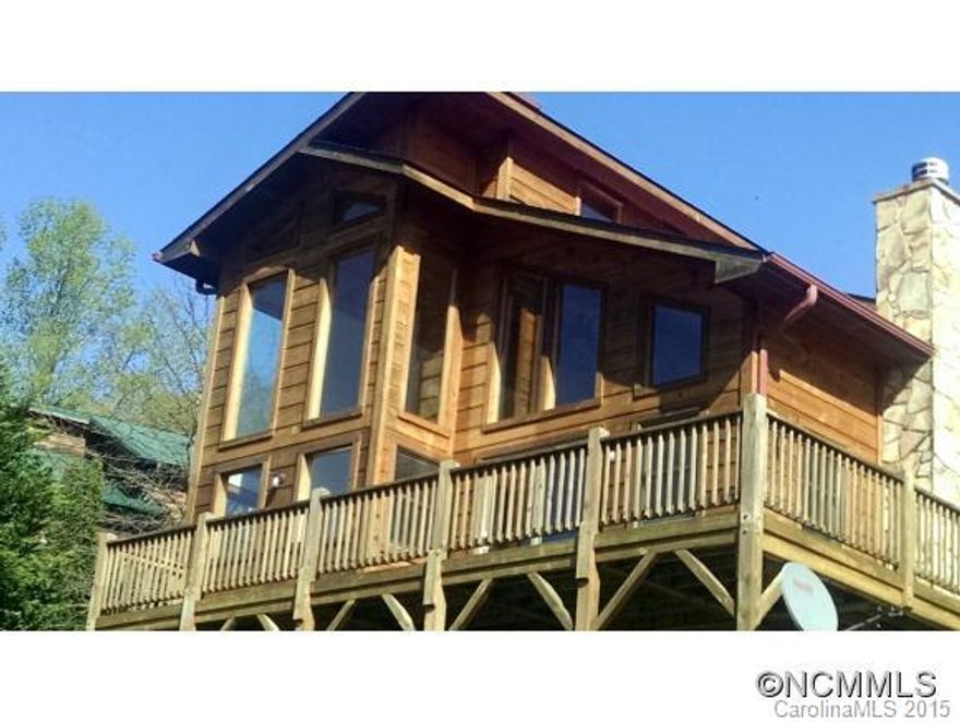 This contemporary home has a great view (lots of glass), paved access, and convenient location. The cathedral ceiling rises above the great room and overhanging loft. The kitchen is efficient with lots of cabinets.  The primary bedroom is on the main level with its own bath.  The bath also opens to the great room for guest.  BR 2 is on the second level and is ensuite also.  Floors are hardwood, carpet and tile.  Please see the Virtual Tour.