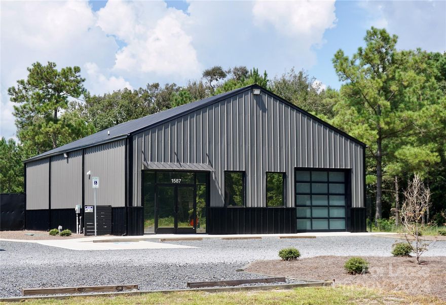 Located in the thriving hub of Brunswick County, NC, this newly constructed 2,400 square foot standalone building is perfectly suited for office and warehouse use, combining quality construction with versatility. The building features a clear span warehouse with impressive ceiling heights—14 feet at the eaves and up to 20 feet at the center—accessed by a 10x10 electric roll-up door equipped with vision lites and a remote control for easy operation. The space includes a 12x12 conditioned office/showroom with French doors and front-facing windows that feature tinted glass for both privacy and energy efficiency. Strategically located, the property grants smooth access to NC 211 and Hwy 17, making it an ideal connection point to key locations such as Supply, Oak Island, Southport, Holden Beach, Ocean Isle, Leland, Wilmington, Myrtle Beach, among others. This property presents a prime opportunity for businesses looking to establish or expand their footprint in this flourishing region.