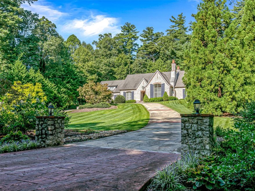 Casual elegance at its finest in superb custom European style home with magazine quality  finishes. Tucked away, private location minutes from restaurants, entertainment, and downtown but in the tony estate area of Flat Rock.  Ideal for entertaining or just personal pleasure this home will embrace you with luxury. Inside you will find open vaulted spaces, exceptional finishes and a brand new kitchen. From the heart pine flooring to soaring space. In the three car garage is space for a workshop and copious storage. The three bedrooms are all ensuite many with walk in closets. Three of the bedroom areas have a sitting area as well with the master area comprising an entire suite. A main floor ensuite room with a closet may be used as a bedroom instead of one of the two upstairs bedrooms.  Alternately any one of the four ensuite rooms could be an office.  Homes of this design, quality and style are rarely available unless you custom build them so don't miss this one.