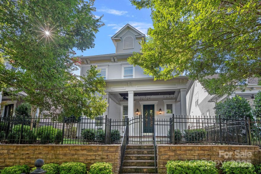 Here is your chance to own a gorgeous home in the golf course community of Springfield, Fort Mill. Southern Front porch, Charleston style home with oversized 2 car garage. 3 Bed and 2.5 bath. Main floor offers Hardwoods throughout with 10-foot ceilings, dining room, gourmet kitchen with oversized island, gas cook top, living room with gas fireplace, ½ bath, laundry, primary bedroom suite on main with a spa like bath, oversized shower & two walk in closets.  Upstairs you will find 9-foot ceilings with oversized loft, 2 more generously sized bedrooms and jack & jill bath.  Tons of storage with an oversized walk-in attic offering over 550 sqft of storage space. HOA amenities include 3 pools, tennis and pickleball courts, nature trails, playgrounds, pavilion, community events, and membership to Anne Springs Greenway.  HOA dues include basic lawn maintenance in addition to common amenities. Springfield is a Public Golf Course, no membership required.