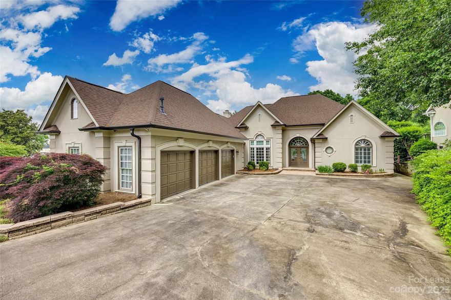 Stately executive home with expansive, flexible floor plan, tons of storage and loads of custom details on the water! Impressive, light-filled entry gives way to formal dining with gleaming wood floors & gorgeous waterfront view living room. Second generously sized family room with tall vaulted ceiling opens to spacious kitchen boasting huge center island with bar seating, SS appliances (gas cooktop & single oven!), tons of storage & more wood floors! Light & airy loft room with stunning views. Sizable owner’s suite on main level features luxurious bath with split vanities, dramatic soaking tub, large shower & walk-in closet!  Back patio deck opens to owner's suite, family room and living rooms PLUS bonus bedroom/media room on 2nd level! Close to shopping, dining & entertainment; quick HWY access, close to SC/NC border!