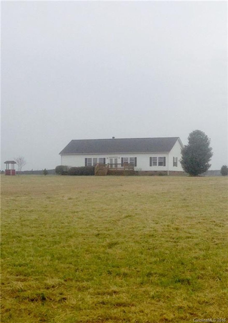 Very well maintained home, with room to roam.  Wide open country views.  Walk in closets in all 3 bedrooms and garden tub in master bath.  Stone fireplace in the living room.  Kitchen with a large island and plenty of storage. Nice sized front porch and a large covered back deck.  Storage building.  A must see!  This place will make you feel right at home!