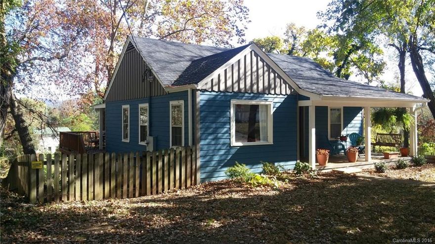 Delightful remodeled bungalow in beautiful, convenient location with sunny level land and mountain views! Minutes to Biltmore, minutes to downtown, this home has all of the traditional bungalow features you want-plaster walls, wood floors, high ceilings, cozy styling, but updated with new Hardiplank siding, new roof, new heat pump, front and back decks, newer kitchen and bath, and fenced area for pets, too! There's even room for a basement workshop or music studio. Won't last long!