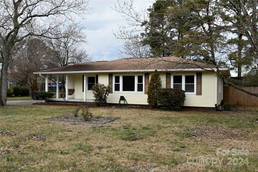 Looking for a city home with a large lot, this beautiful ranch home on nearly half an acre is just minutes from I-77! Home features new LVP flooring, a fresh coat of  paint, updated bathroom, updated kitchen with new cabinets, granite counter tops and new appliances. Property has a huge flat lot with fenced back yard, and is ready to move in!