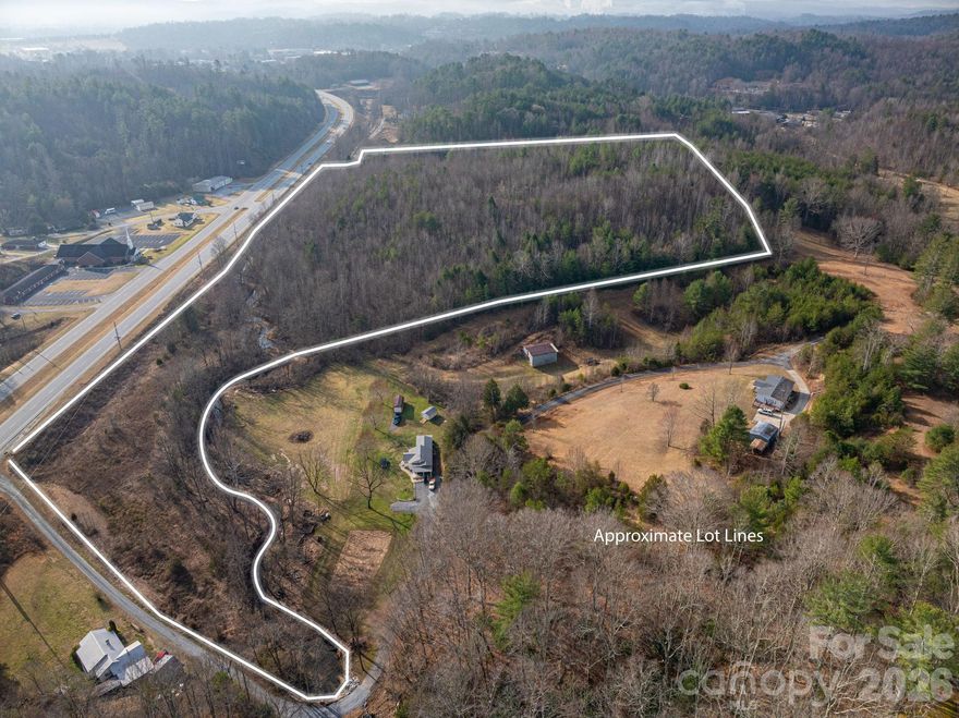 Unlock the potential of this nearly 30-acre tract ideally positioned just off Blowing Rock Blvd (US Hwy 321) and only minutes from the Lenoir city limits. With excellent highway access and proximity to town amenities, this property offers a rare opportunity for developers, investors, or visionary buyers looking to capitalize on the area's continued growth.

Currently zoned RR (Rural Residential), the land is well suited for single-family residential development, making it an attractive option in a region experiencing steady demand for new construction homes. The property features a beautiful winding creek along the front boundary, adding natural character, privacy, and a peaceful setting that future homeowners will appreciate.

Much of the acreage is maturely wooded, providing a scenic backdrop and flexibility for thoughtful development, while an existing cleared section offers an immediate starting point for planning and building. With the Blue Ridge Mountains nearby, the property captures the charm and natural beauty that make Western North Carolina so desirable.

The site will require well and septic installation, allowing developers flexibility in design and layout. Additionally, there may be potential for future commercial rezoning, creating expanded possibilities for those seeking long-term investment or mixed-use potential in this highly accessible location.

Whether you're envisioning a private estate community, a residential development, or a long-term land investment, this property presents a rare combination of location, natural beauty, and development potential.

The existing home on the property is uninhabitable. No information is available regarding water or septic connections. For safety reasons, please do not enter the house or barn. Listing includes three parcel IDs.