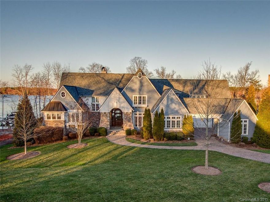 One of Lake Norman & The Point's quintessential Nantucket style estate homes. This Simonini-built classically designed property exudes casual lakeside elegance. Coastal accents throughout including light and airy kitchen, center island, extensive custom cabinetry, and professional grade appliance package. Private owner's salon with lake views, great room with hardwoods throughout, covered lakeside terrace, wine/entertainment spaces on lower level, adjourning to spa-pool and private dock.
