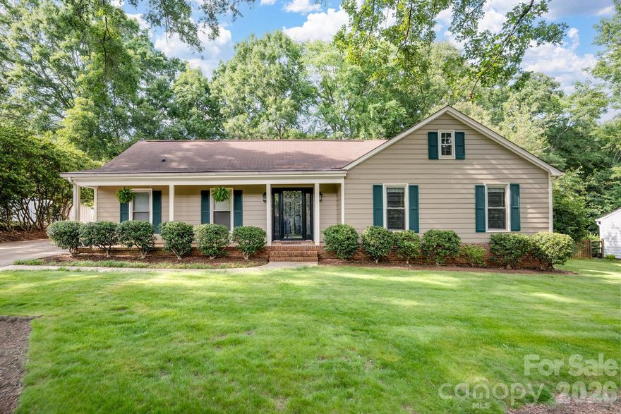 Welcome to 11831 Parks Farm Lane, an incredible real estate opportunity in Charlotte's highly desirable Raeburn neighborhood. This home features 4 bedrooms and 3 full bathrooms with two bedrooms being en suites, including a spacious master bedroom addition that serves as an expansive, private retreat.  The main living space is anchored by a family room with a fireplace and cathedral ceiling, which flows into an updated kitchen boasting sleek quartz countertops. Situated on a generous 0.42-acre lot with mature trees, enjoy the outdoors on the spacious travertine patio, perfect for grilling, dining and entertaining!  This property feeds into South Charlotte's top-rated schools. Raeburn community includes outdoor pool, tennis and pickle ball courts, playgrounds, recreation field, basketball court, and walking trails! Convenient to shopping and dining, located between Stonecrest and Blakeney, and minutes to Ballantyne! Buyers will not want to miss this home! Sellers replacing carpet and painting two secondary bedrooms or will give a 2k concession if buyer prefers to do that themselves