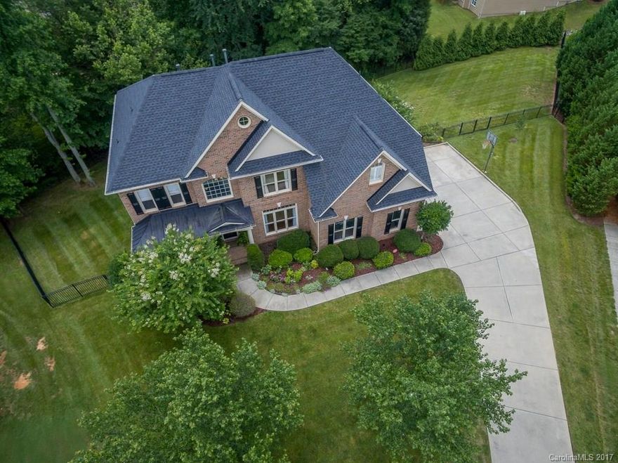 Sensational Indoor & Outdoor Living Spaces in Bridgehampton! Beautiful upper Covered Deck w/ eating area & stone gas fireplace. Lower level half circle paver patio w/gas fire pit. Front Porch. Open floor plan w/ Gourmet Kitchen, Great Room w/fireplace & wall of windows. Guest on main. Luxurious Master. Walk-out Lower Level w/Theatre Rm, Gym or 6th BD & Family Rm w/ Wet bar. UPGRADES GALORE: lighting, cabinetry, audio & sound systems & built-ins. See the full list online. MUST SEE THIS ONE!