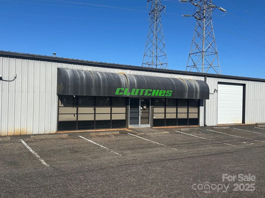 Fantastic I-40 visibility just off Old Mountain Rd exit, Iredell county. Zoned industrial (M-1) building is perfect for a number of uses, formerly a motorcycle dealership. Has 2 roll up on grade doors with access to warehouse. Propane supplemental heaters in ceiling. Available for lease 7k/month.