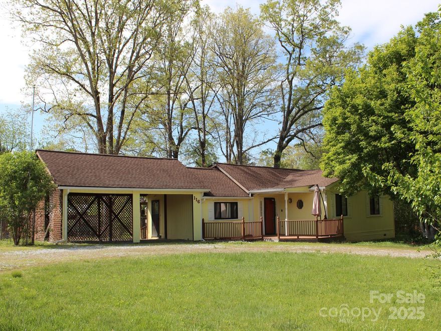 Cute cottage style home with an unusually large 1.2 ac lot. One level living. Just off Spartanburg Hwy and only a minute to town. Close to Blue Ridge College, grocery stores, the COop, Health Dept, etc. It is in the ETJ district but not in the city. Den with French doors off of Living room/dining room. Kitchen has double wall ovens and flat top stove. Primary bedroom has a half bath and hall bath has double vanities. 1/2 bath possibly could be enlarged into the walk in closet area.  Washer and dryer connections are in the closet on the enclosed porch room. Land is pretty flat with some nice trees and backs up to Forest Lawn Rd for optional back yard access through gate. May be able to build a 2nd home or guest quarters if it perks for septic. Big garden possibilities.  Decks in back and porch in front. Old workshop has been removed.  Drainfield repaired in 23.  Much of the property is fenced. No Helene damage to house--just a limb that fell on the fence.