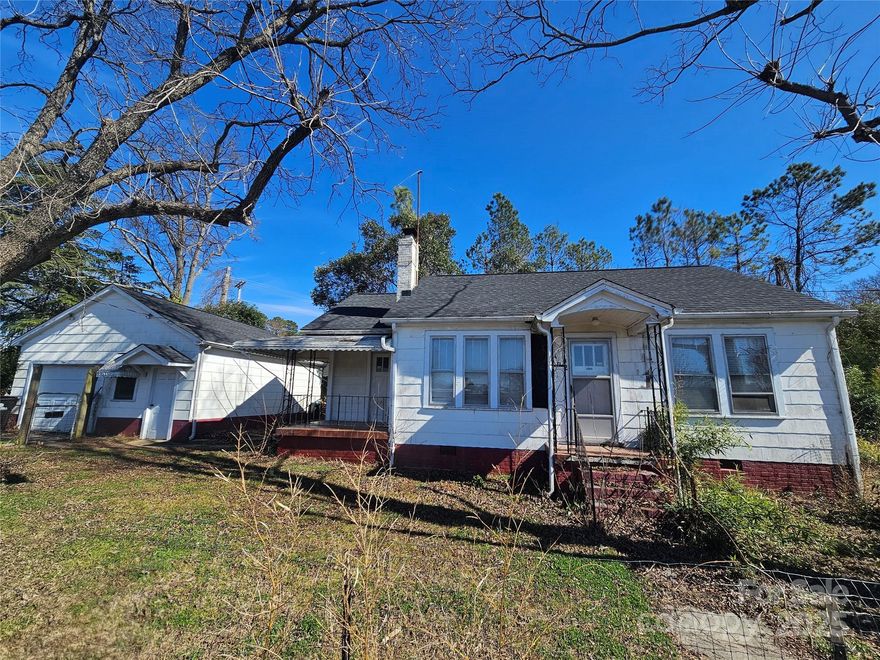Location! Location!   Here is your chance to own in the heart of major commerce right off of 
Ebenezer Rd and walking distance to Winthrop University.   Surrounded by "commercial" businesses, currently rented, but has endless possibilities for the right buyer.  This home contains hardwood floors, roomy hallway, lots of windows, ceramic tile and more!   2BR, 1BA, Formal dining area with archway, mud/laundry room off the kitchen, as well as a fenced front yard and a detached 1 car garage that is large enough for a shop.  Property is zoned OI (Office/Institutional).  A buyer wishing to use this property as a Residence would need to apply to the City of Rock Hill for special zoning after closing.  Developers should contact the City of Rock Hill to discuss "your vision" for this property.  Being Sold As Is. Minimum of 24 hour notice required for all showings due to tenant occupancy & Appointment is required.  (Also listed as a Residential Type Listing under MLS#4223661)