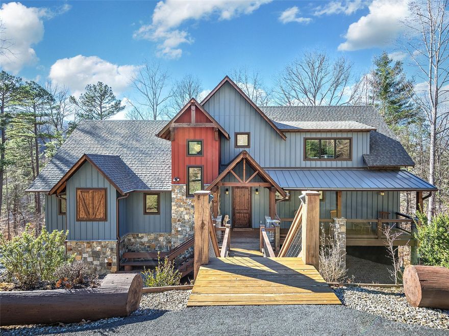 Indulge in the epitome of luxury with this magnificent custom residence nestled in the prestigious Town Mountain Preserve, a 10-minute drive from downtown. Thoughtfully designed, this residence boasts a gourmet kitchen, primary suite on the main level featuring an expansive walk-in closet, gleaming hardwood floors in the main living areas, and sumptuous carpets in the bedrooms. Guest bedrooms reside on a separate floor while 2 offices, elegant family room, and mother-in-law suite potential enhance the home's functionality. 3 decks beckon outdoor enjoyment. Featuring 4 beds, 4.5 baths, vaulted ceilings, and an abundance of natural light, this home is designed for both comfortable living and entertaining. Nestled on 1.75 acres, property includes 2-car garage, workshop/studio, and areas dedicated to hobbies and entertainment. This residence seamlessly combines sophistication, functionality, and serenity, presenting a rare opportunity to embrace refined living in the heart of Asheville.