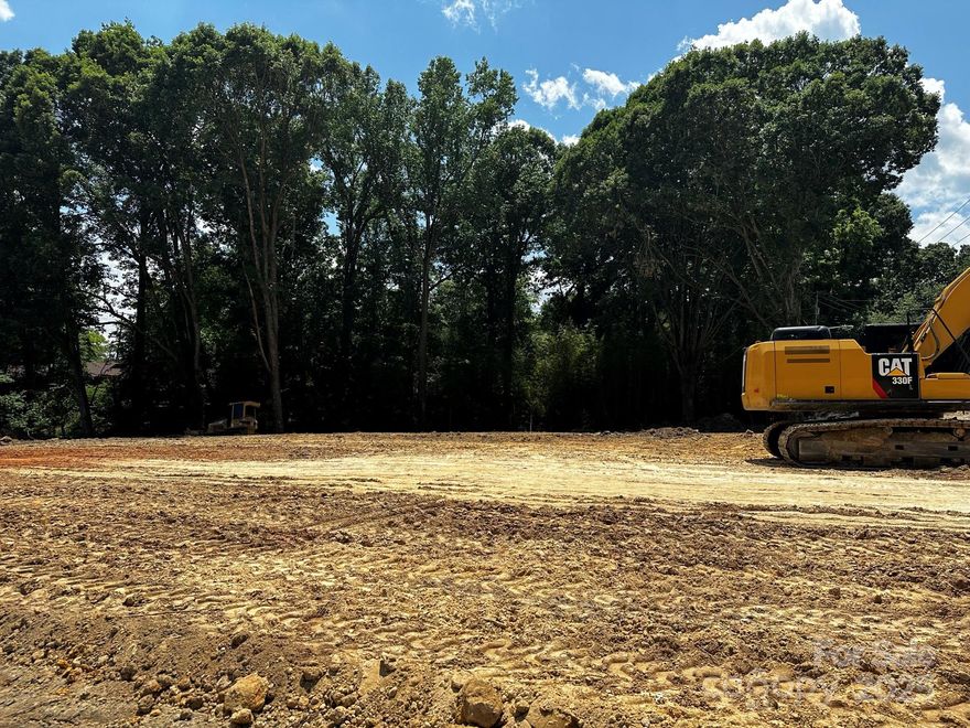 New topo survey uploaded with building pad. See attachments for concept plan for self storage, 18 unit apartment, or 11 unit townhome. Approximately 137x112 flat spot inside the setbacks. Large lot on main artery with 10,000+ average daily car count per NCDOT.  Possible uses are Multi family, ABC Store, Self Storage, Check cashing, Firing range, Retail, Restaurant, Funeral Home, Laundromat, Medical, ETC. See attachments for full list of uses by right and all uses with supplemental regulations. 76,000 residents within 5 miles, Median household income is $119,520. Owner is realtor.