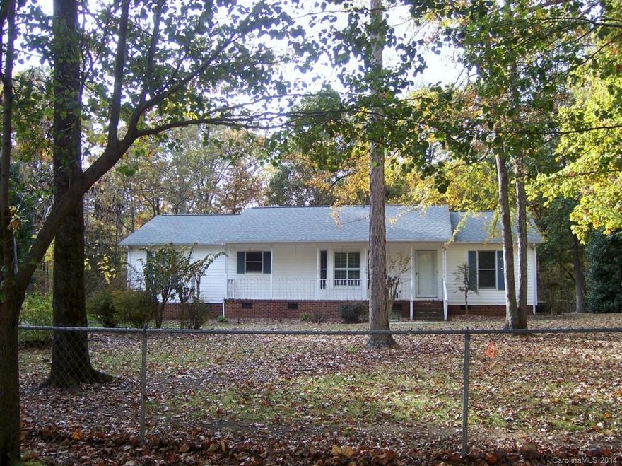 Nice piece of land and not too far out 10.6 acres wooded land with a nice ranch style home with hardwood floors, sunroom screened porch, split bedroom plan and fenced yard.