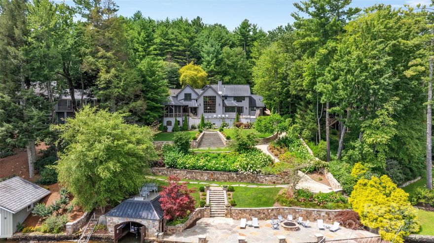 One of Lake Toxaway and Western North Carolina's finest homes, this acclaimed Keith Summerour designed residence is situated on a stunning lakefront lot very close to The Lake Toxaway Country Club, Greystone Inn, and Marina.  Featuring three bedroom suites and two half baths, this magnificent home has many luxury features including a copper roof, copper clad windows, copper gutters, impressive great room with soaring stone fireplace and massive window framing the water, chef's kitchen with Sub Zero and Wolf appliances, wine room, expansive stone terrace with fireplace, and beautiful octagonal screened porch with additional outdoor fireplace.  This estate level property also features a cart path to the lake, large stone dock with gas firepit, and one of the most attractive boat houses on the lake.