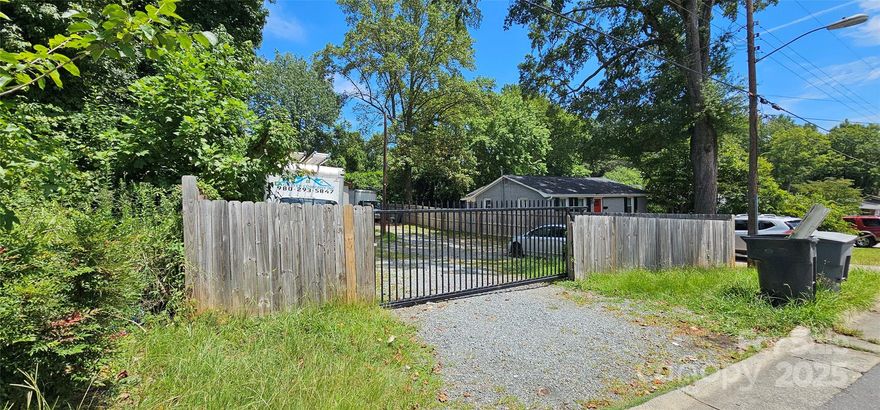 Great lot with a storage building in a fantastic location. Approx .20ac, fenced with manual entrance gate. Survey attached. According to Mecklenberg County, the property is zoned NB-1. Verify use with Mecklenberg County.