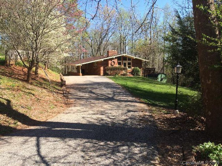 3 Br Plus Brick Home -- Ranch Traditional - style home with 3 bedrooms and 1.5 bathrooms. The upper floor has a great room with fireplace, the 3 bedrooms, and 1.5 bathrooms. The lower level (1/2 finished basement) has a den. The other 1/2 of the basement is heated but unfinished for great storage.  The exterior has a great full length deck. The lot is +/- .672 acres and features a nice back and side yard plus a large storage building. The location places the home very convenient to downtown Marion and Asheville. This home's size and amenities make it an excellent value at $149,900.