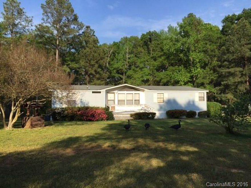 Enjoy Country Living in this Cozy and Tidy 3 bed/2 Bath home! Beautiful Level yard on over an acre lot! Side door leads  to the kitchen with a breakfast area, pantry and lots of counter space. Refrigerator stays. Laundry room has shelving. Dining Room with two built in cabinets. The stone wood burning fireplace is the focal point of this spacious Living Room. Entertain on the double deck in back. Master Bedroom has 3 closets for additional storage space. Two 8x10 Storage Sheds. Great Value!