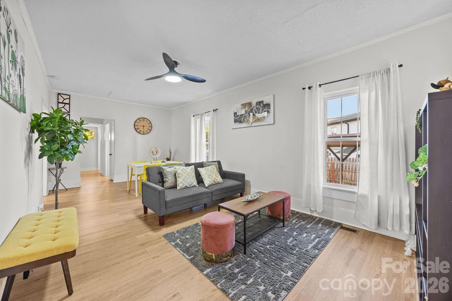 $15k Price Improvement!! Yes, it’s just as charming in person! This beautifully updated bungalow truly has it all. Picture yourself on the covered front porch, gently rocking in your chair while sipping something delightful and soaking in the moment. Step inside to a bright, open family and dining area where newer LVP flooring flows seamlessly throughout. The expansive great room is thoughtfully designed to maximize space, offering flexibility to create distinct living areas while still feeling airy and inviting. The spacious kitchen features a gas stove, granite countertops, a stylish subway tile backsplash, stainless steel appliances, and a bistro nook area. Just off the kitchen, you’ll find a convenient laundry area complete with cabinets and a storage closet. Continue outside to the large deck, an ideal setting for entertaining guests or unwinding in your own private retreat. The generous primary bedroom offers (2) closets and a ceiling fan for added comfort, while the main bathroom impresses with a chic vanity and tiled tub/shower combo. Currently operating as an Airbnb, this home is being sold fully furnished (with select exclusions), making it a turnkey opportunity. All of this sits on a flat, quarter-acre lot with a fully fenced backyard, perfect for gardening, outdoor fun, or even adding a pool. Brand NEW 2025 HVAC, Ample parking and so much more await! All just minutes from the energy and charm of vibrant downtown Concord.