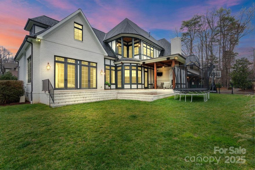 Welcome to 4336 Tottenham Road, a luxurious custom-built Grandfather home in the GATED Village at Tottenham in SouthPark, Charlotte. One of the best features of this 4 bedroom home is it's 4.5 bathrooms allowing for every bedroom to have it's own bathroom. Between the solid-core doors and the carefully designed floor plan, this home is quiet all throughout.  The gourmet kitchen boasts a new Thermador fridge, faucet, and dishwasher, plus a large island and breakfast area. The theater room with a state-of-the-art projector sits off the bonus room, and massive attic storage adds convenience. TWO staircases provide easy access. Outside, enjoy a putting green and electric car chargers in the 3-car garage. Included is a one-year-old carpet upstairs, oversized water heater, two HVAC units. The landscaped yard features in-ground irrigation AND a putting green! This exceptional home offers modern upgrades, entertainment spaces, and easy access to shopping and dining. Schedule your tour today!