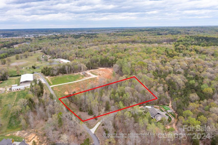 The lot you have been waiting for! This 4 acre, wooded lot, is ready for your custom dream home. With no HOA, you can build exactly what you desire. Approved 5 bedroom septic permit in hand. Plat and survey already complete. Only thing left to do, is to start designing. The property is located in the County limits. Neighboring properties have beautiful equestrian facilities. Come take a look today!