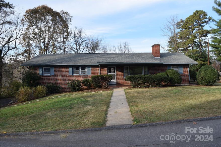 Welcome to this charming ranch-style home, full of potential and nestled at the end of a quiet street on a spacious 0.5-acre lot! This 3-bedroom, 2-bathroom home can be updated to your personal needs. Inside, you'll find all essentials on the main level, including convenient main-floor laundry. The full basement provides excellent additional space, with one side partially finished and equipped with a second laundry hookup—ideal for a workshop, recreation room, or storage. Outdoors, enjoy privacy and space for gardening, entertaining, or relaxing in a tranquil setting just steps from the heart of downtown Weaverville. Walk to local shops, dining, and parks with ease, enjoying all that this vibrant community has to offer. With great potential for updating, this home is perfect for those looking to personalize a well-kept property in a fantastic location.