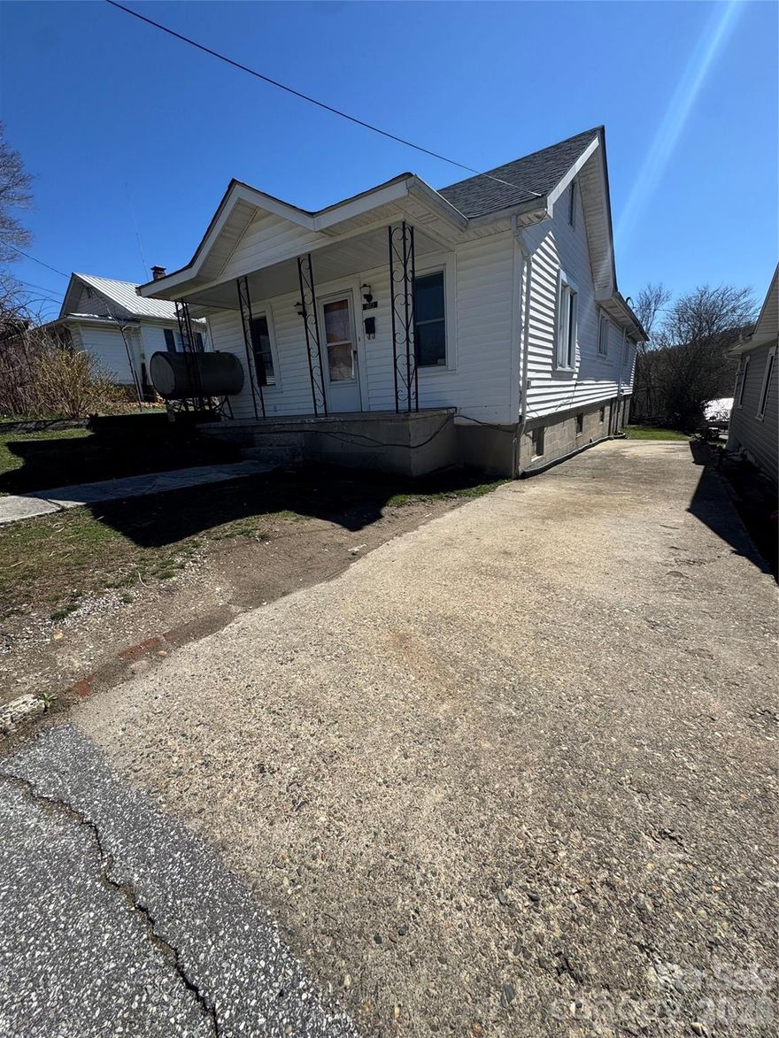 If you’re looking for a home within the City Limits of Spruce Pine, this one is sure to impress. Ideally located on English Street, the property offers convenient access to the YMCA, shopping, restaurants, and many other local amenities. As you step inside, you’ll immediately notice the spacious open living area and an impressive primary en-suite bedroom featuring ample closet space. The kitchen offers an abundance of cabinetry and flows seamlessly into a large dining area, making it great for everyday living and entertaining. Upstairs, you’ll find a fully finished attic space with walk-up steps and generous storage areas. The lower level features a finished basement with extra rooms and a dedicated laundry area. There is also an additional space that could easily serve as a wine cellar. Town Water and Sewer is a big plus! Don’t miss the opportunity to view this beautifully updated home in the heart of Spruce Pine.