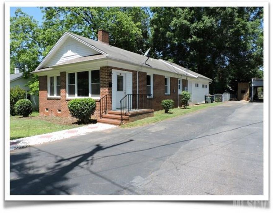 So much room for the money.  This older home has all the charm but has recently been remodeled to give it an open floor plan with a larger kitchen and more modern feeling.  Walk through the front door into the livingroom, open up to an eat in area and kitchen.  Kitchen has double the cabinets now and counter space.  They also added a pantry.  There are three bedrooms up front with a shared bathroom and the master suite is at the back with two closets and master bathroom.   There is a smaller room across the hall that could be used as a small office, or even made into a dream closet space, or just used for storage. At the very back is another room you could have an office, work out room, formal dining or play room, also has door to the fenced in back yard. A GE whole house water filtration system was installed about a year ago. There is a small park behind the home but also very close to the Conover park and splash pad. Just off hwy 70, with easy access to I40 or HWY 16.