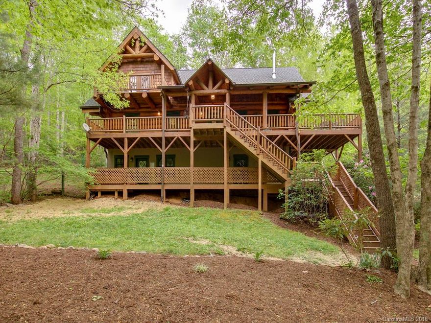 Gorgeous hand-crafted log cabin situated on a rushing creek. 5-foot eaves, windows imported from Canada. Open floor plan w/cathedral ceiling and a cozy wood stove. Lots of glass door onto the wraparound deck. Hot tub on deck conveys. Firepit by the creek and fenced side yard. Very successful vacation rental currently!