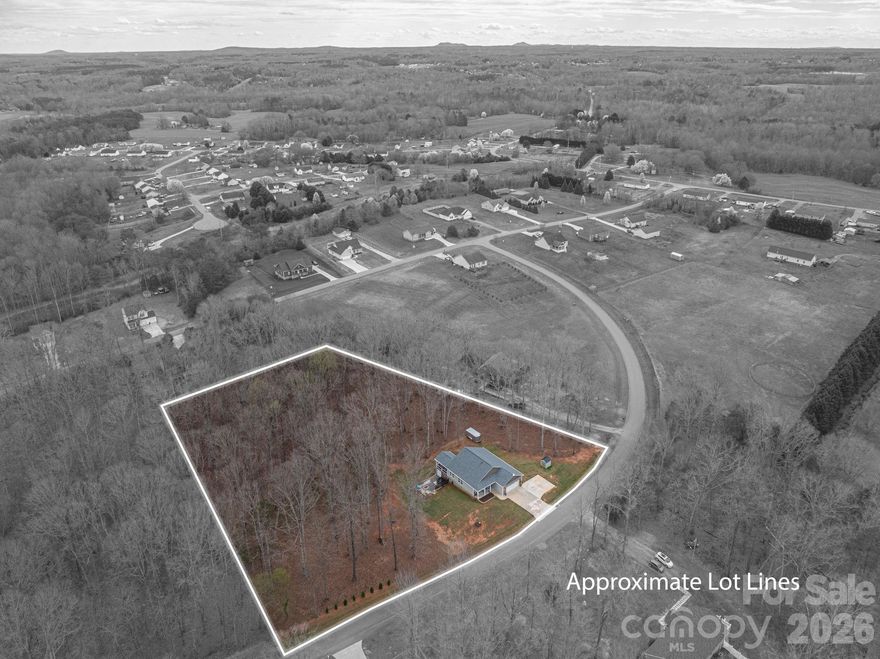 Set on over 2 private acres, this property offers the perfect blend of space, privacy, and room to entertain. Tucked into a peaceful setting, the home provides the kind of breathing room many buyers are searching for while still offering comfortable, functional living spaces inside.

The interior features bright and inviting living areas with a layout designed for everyday living and gathering with family and friends. Natural light flows throughout the home, and the well-appointed kitchen and living spaces create a warm, welcoming atmosphere.

Outside, the property continues to shine with multiple improvements designed for both convenience and outdoor enjoyment. A concrete turnaround in the driveway adds ease of access and additional parking. The spacious back deck features upgraded waterproof flooring, aluminum railings, and solar lighting- creating an ideal setting for relaxing evenings or hosting guests. The outdoor space also includes a fire pit area with a concrete pad and privacy hedging that enhances the secluded feel of the property. Beneath the patio, an enclosed shed provides convenient storage for tools, equipment, or outdoor gear.

With over 2 acres, thoughtful upgrades, and outdoor spaces designed to be enjoyed, this property offers a rare combination of privacy, functionality, and entertaining potential.