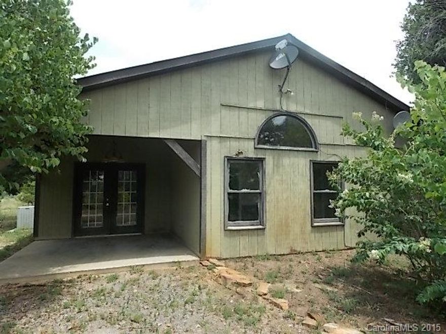 Great Rural Rowan County Rustic Home on 40+- Acres with Pond, Detached Large Garage/Workshop with Live Bait Well. Custom Wood Features and Ceramic Tile Flooring. Close to High Rock Lake, Tuckertown Dam, and Uwharrie National Forest.