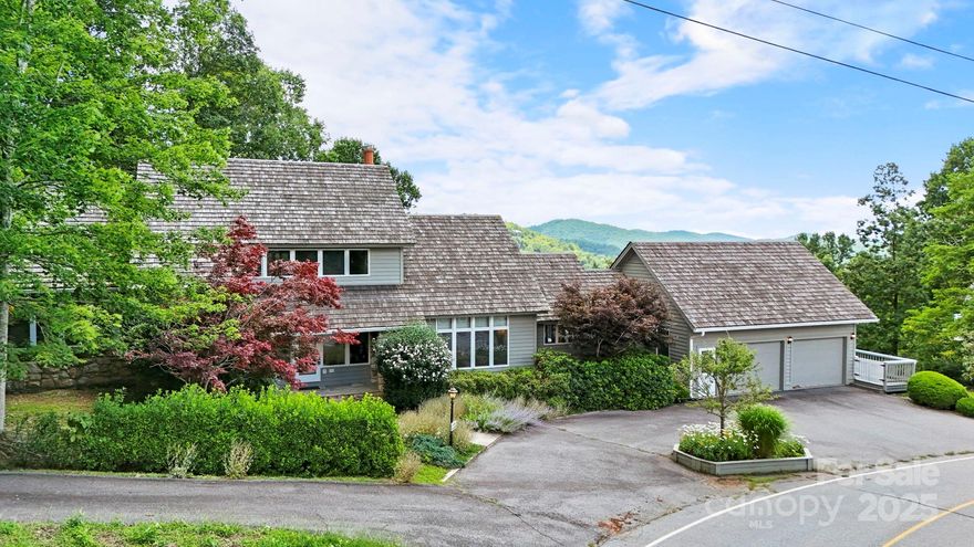 Charming home w/ long-range views in gated community of Hound Ears- great full-time residence, mountain getaway, or investment property w/ ST rentals permitted. Located between Boone & Blowing Rock, Hound Ears is easily accessible year-round. This 3BR, 3.5BA home is offered furnished on over an acre w/ unique rock outcroppings. Main level features great room w/ vaulted ceiling, skylights, wall of windows, & fireplace—adjacent to dining & kitchen w/ SS appliances, granite, & breakfast nook. Spacious deck features gazebo overlooking views & yard. Main-level BR suite offers fireplace & window bench. Also on this level, find foyer/entryway w/ stone flooring, laundry, & access to 2-car garage. On the 2nd level, find a primary suite w/ private deck, large closets/storage, unique BA w/ dual vanities/toilets connected by shower, & jetted tub. A 3rd BR suite exists upstairs & offers window bench & small loft. Circular drive provides easy access to the garage & covered stone patio at entry.