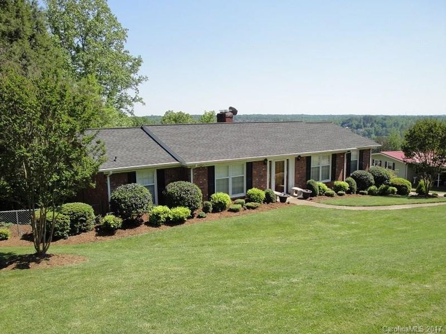 It is like traveling in the mountains & then the lake appears and your home. Enter living area and dining room combo. Open kitchen is sunny with 2 sets of glass doors leading onto the composite deck to enjoy privacy & lake views. Kitchen offers white cabinets, stainless appliances, wine cooler, pantry, hardwood floors & open to the Den w/fireplace. 3 full upgraded baths. 3 BR/2 BA on main level. Partially finished basement features Rec Rm with 2nd FP, bedroom, 3rd bath.