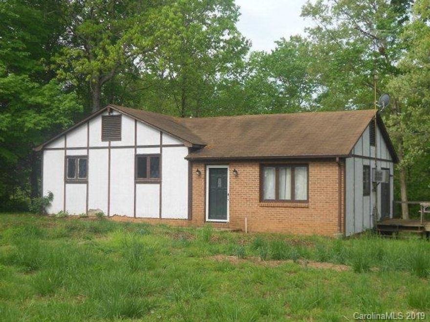 This 3 Bedroom, 1.5 bath has open living and dining area, nice sized yard, sliding doors open onto side deck, washer and dryer connection is located in the kitchen. Light restrictions. HOME SOLD AS IS.  TLC could bring this home back to life.  Nice neighborhood.  Call for a private showing today.