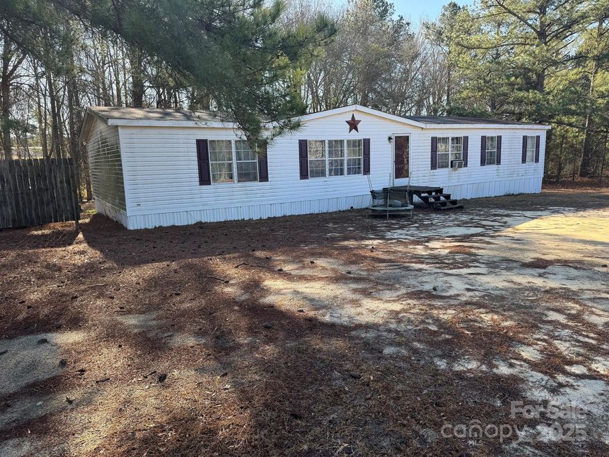 If you are looking for a handy man special then look no more.  This home is located on just about an acre in a country setting/  Located just minutes from Chesterfield and Wadesboro you have options for entertainment, food, and groceries.  The lot is level with water and septic installed.  Large 3 bed 2 bath Manufactured Home with lots of potential. Large primary bed and bath, open floor plan in center of the home put your skills to work and see what you can create. The remodel was started but seller has decided to sell As-Is with no further work to be done.  Don't miss out on this great investment opportunity.  Please do not stop at the property without your real estate agent.