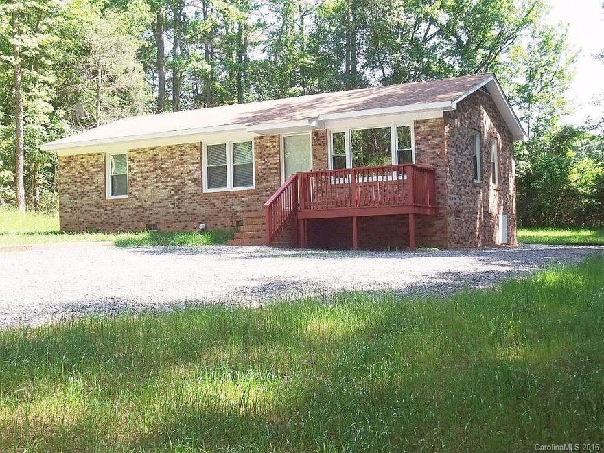 Attractive starter home  located in rural setting and secluded.   Home is low maintenance and move in ready with new paint.  Home has beautiful  wood floors recently refinished and new vinyl in kitchen and bathroom.    Must See !!