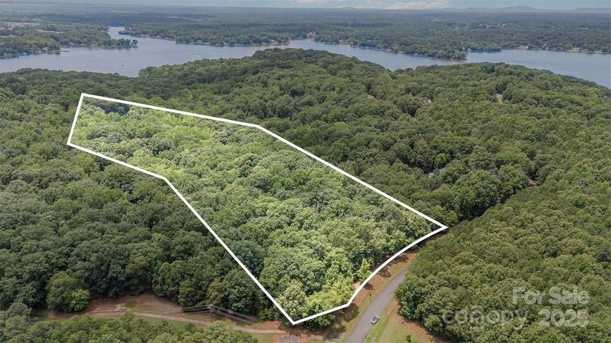 A stunning 5.12-acre lot in incredible community - The Sanctuary. This gently sloping lot is perfect for building your custom dream estate tucked away among the large mature trees for true peace and serenity. A tree lined common area (of nearly 14 acres) sits across the frontage of this property for additional privacy. The Sanctuary is a prestigious lakeside community on Lake Wylie with a seven-mile shoreline. There is a 17-acre waterfront amenity area w/ swimming pools, a fitness center, a boating center, & more. There are six private tennis courts, two of which are lighted for nighttime play, and more than 20 miles of hiking/walking trails. The Sanctuary has dock slips available for lease for Residents. Community is just minutes from local shops & restaurants including the Charlotte Outlets. Visit The Sanctuary's website, so you can see what a beautiful place this is www.thesanctuaryatlakewylie.com and check the attachments for additional community guidelines.