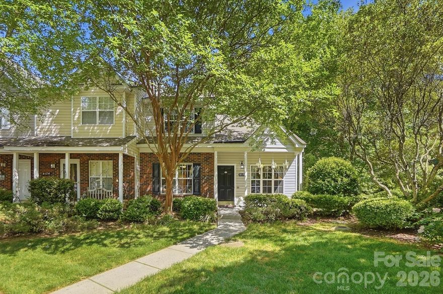 This charming end-unit townhome is a true showstopper—beautifully maintained and shows like a model! Nestled in the desirable Holly Ridge community, you’re welcomed by tree-lined streets and inviting surroundings. A covered front porch leads into a stunning two-story family room filled with natural light, creating a bright and airy feel.

Modern finishes shine throughout, including upgraded lighting, neutral paint, and low-maintenance vinyl flooring. The main-level primary suite offers convenience and privacy, while the cozy gas fireplace with custom stonework adds warmth and character.

The kitchen features a center island, pendant lighting, white cabinetry, and stainless steel appliances—including the refrigerator. Washer and dryer also convey. Upstairs, you’ll find two additional bedrooms and a hall bath. If an additional upstairs bedroom is not needed, the versatile flex space is ideal for a home office or media space.

Enjoy peaceful evenings on the rear patio backing to a natural, private setting—ideal for relaxing or entertaining. Holly Ridge offers charming details, including themed street names, a community pool, pond, and walking trails. Conveniently located near Huntersville with easy access to I-77 and I-485. New HVAC (2022). Move-in ready and a must-see!