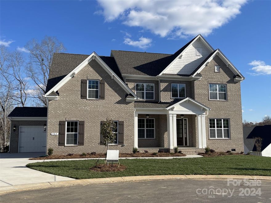 4-sides brick home on a .51 acre cul-de-sac homesite that backs up to mature trees. Extra storage space in the tall crawl space! 1st floor guest suite, rear covered porch, Living rm w/ French doors, Bonus Rm & 3-car garage. Butler's Pantry w/ cabs & wine fridge connects the Dining rm w/ Kitchen. Mudroom drop-zone. Family rm w/ gas FP & 16' sliding doors to the rear porch. Kitchen has quartz counters & backsplash, LED UC lights, trash pullout, soft close doors/drawers, large walk-in pantry, GE Profile SS app w/ 36" gas cooktop & extraction hood vented outside. 5 beds most w/ their own full bath & 2 rooms share Jack-n-Jill bath + bonus Room. Primary Suite w/ huge walk-in closet & tray ceiling. Bathroom w/ free-standing tub, large tiled shower w/ frameless surround, & quartz counters. 6.5" French oak hardwoods. Community resort-style amenities & Ft Mill schools.