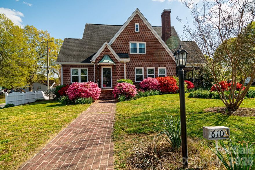 MAGNIFICENT 3600 SF Historical Cornwell Home in Blossoming Downtown Cherryville on half an acre!  Walk to Quaint Shops and Restaurants, Library across the street and Elementary School 1/2 block away! This Spacious Home has a blend of Old and New Features... Gorgeous Original Hardwoods and Updated New Quartz Countertops/Tumbled Marble Floors in Kitchen. You will really enjoy the Sunny "Canning Kitchen"... Large Multi-Purpose room for Laundry with plenty of Cabinets and Counterspace!  Sun Porch AND Screened Porch! Fenced in Yard with a Raised Bed Garden!  2000 SF FIVE BAY GARAGE is another feature that makes this property an incredible value!! 2 bays are a heated/cooled workshop. Don't miss the FULLY ENCAPSULATED BASEMENT! SO MUCH STORAGE!! The new insulation that was added make the heating and cooling bills of this home quite affordable. All utilities are paid to City of Cherryville...electric, water/sewer, trash and average only $250/mo!!