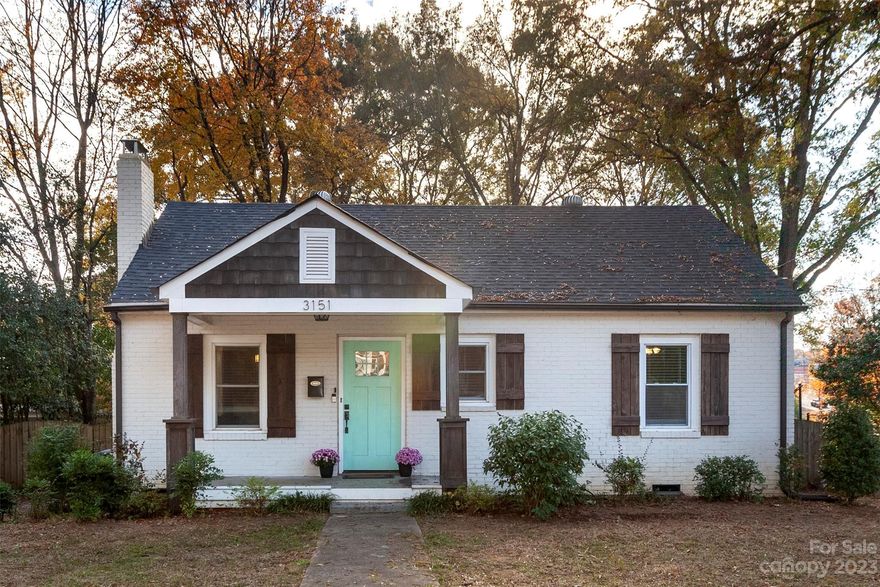 The perfect combination of historic charm and modern updates, this adorable bungalow cannot be missed. Located in popular Enderly Park, this home lives large with three spacious bedrooms, a big open kitchen, and a seamless flow between dining and living areas. The deck, conveniently located off the kitchen, has a lovely pergola and overlooks your fenced in yard and the park. The oversized bathroom features HEATED tile floors, built-in storage shelves, and a flushmount bluetooth speaker. Beautifully finished hardwood floors, and crown molding found throughout the home are just a few of the details that make this home so special. HVAC, roof, hot water heater, and windows all from 2019. Move right in and enjoy living minutes from Uptown, the airport, and steps away from some of the cities most popular restaurants, breweries, & shops.