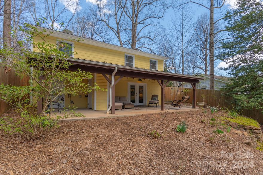MUST SEE: West Asheville gem that includes an additional 875 sq ft of finished space WITH A 4TH BEDROOM AND 2ND BATHROOM in the basement! Conveniently situated on a quiet street, this house has so much to offer including move in ready comfort and additional income possibilities.  The main level offers 3 bedrooms and 1 full bath of bright living space with hardwood floors and an updated bathroom. Basement was converted in 2016 into a one bedroom, one bathroom with living area and laundry room and has been used as a short term Home Stay rental. The additional basement space is not added in the MLS due to ceilings being just a tad shy of the 7' height requirement. 
Enjoy the covered patio, fenced-in yard, perfect for pets and outdoor entertaining. Yard has been professionally landscaped, designated a Certified Wildlife Habitat and requires no mowing!  With its prime location, you're just moments away from trendy shops and delicious restaurants. Don't miss out on this inviting retreat!
