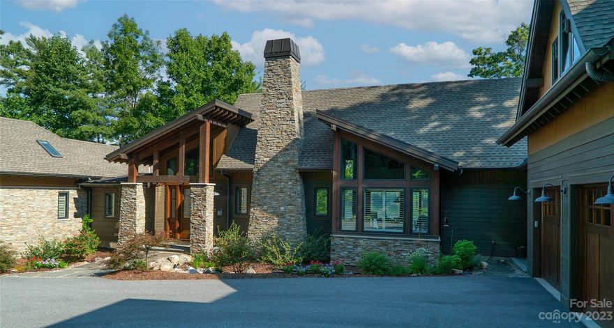 Lake living at its finest! Luxury waterfront home in the exclusive Old Wildlife Club including membership in Camp Lake James social club. Best views on the lake. Great room w/ large stone WB fireplace and year round views of Lake James and Linville Gorge. A gourmet kitchen, powder room, primary suite, laundry and garage are on same level. Out back, there’s a large covered porch with WB fireplace, a half bath, outside shower, firepit and Sundance Spa. Head down to the lake where a huge dock with 2 slips awaits your adventures. The main floor primary is sure to please with a gas fireplace, custom closet and luxurious marble bath. Downstairs are 2 more en-suites, a rec room with wet bar and a large work shop. An attached bonus room over the garage has an additional en-suite, wet bar, and library. Quality custom craftsmanship and detail abounds along with home generator and Smart Home Systems include HVAC, Lighting, security, sound system, garage doors, irrigation and video surveillance.