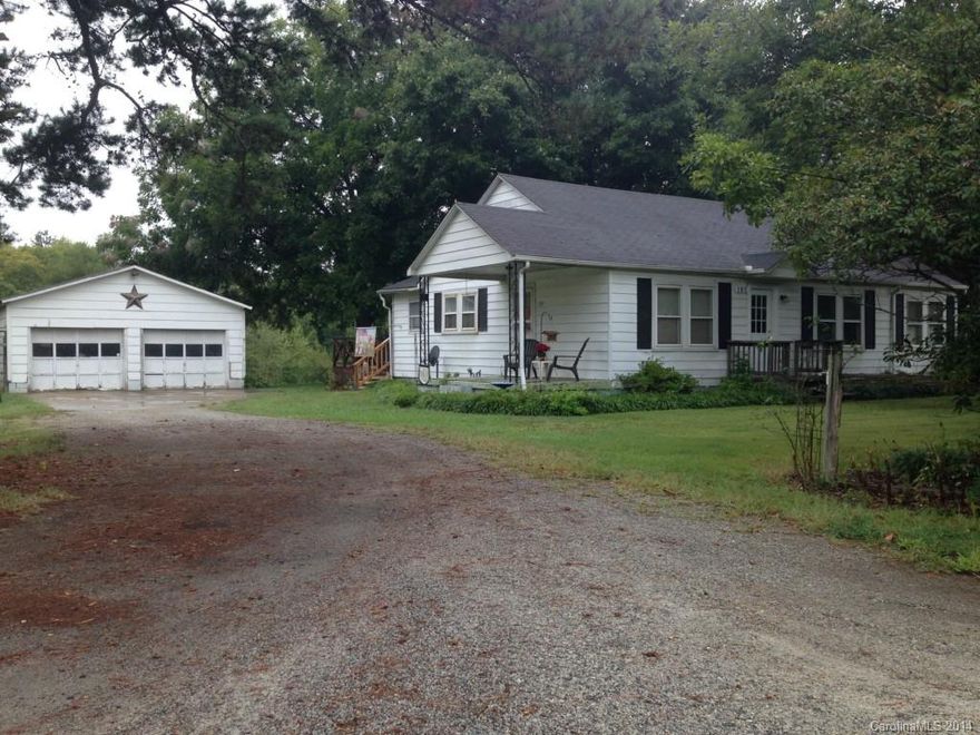 Country living with acreage and just a short distance to schools, restaurants, shopping, churches.  This 3 bedroom home has a 1 year Home Warranty.  Kitchen and bath updates.  Large yard.  Deck for grilling and relaxing in the quiet. As Is