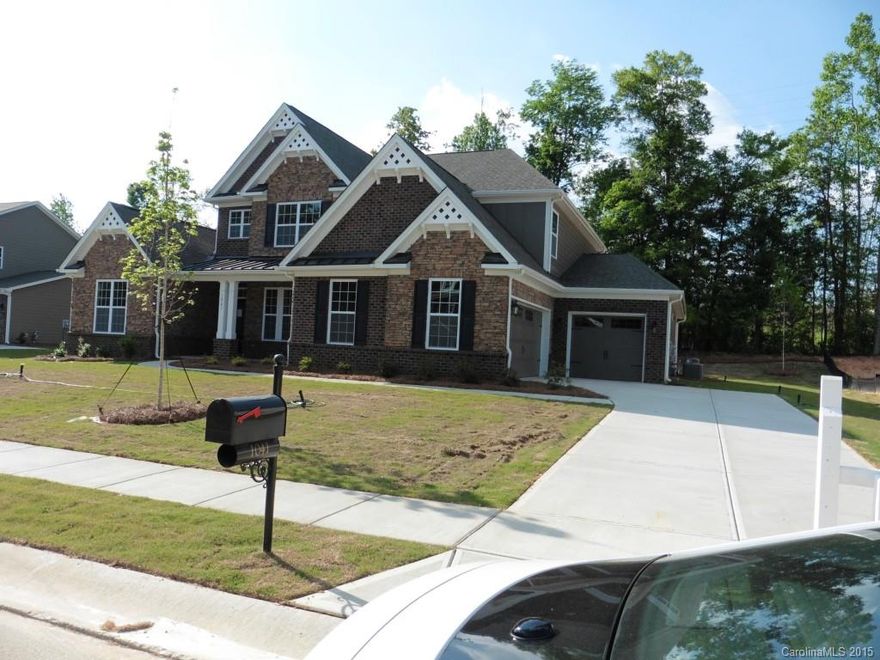 Location, Location, Location! Estate home in Tega Cay in the Prestigious Lake Ridge Community in .  This is a beautiful master down floor plan. Gourmet Kitchen with upgraded Stainless appliances, cabinets, hardwoods on first, granite in kitchen and baths.  Coffered ceiling in dining room and molding package on first floor.  Highly acclaimed Fort Mill Schools, close to I-77, restaurants and shopping galore.  Come and see what Tega Cay living is all about!